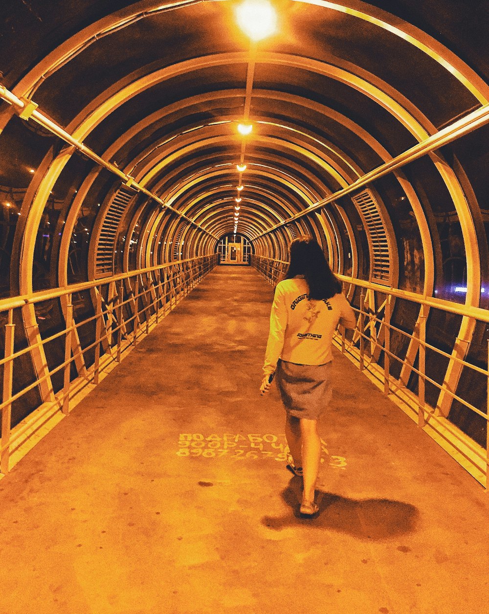 woman in a covered footbridge