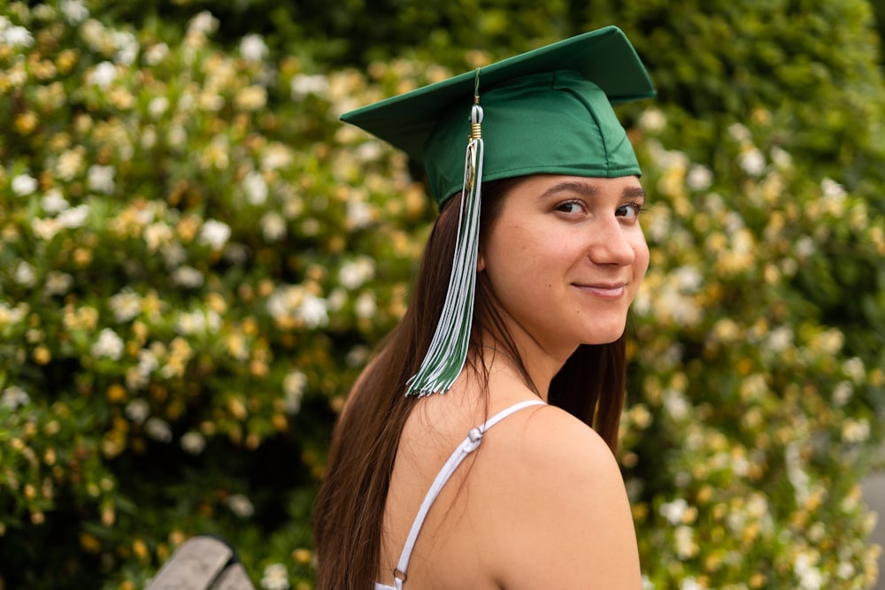 woman wearing green mortar board