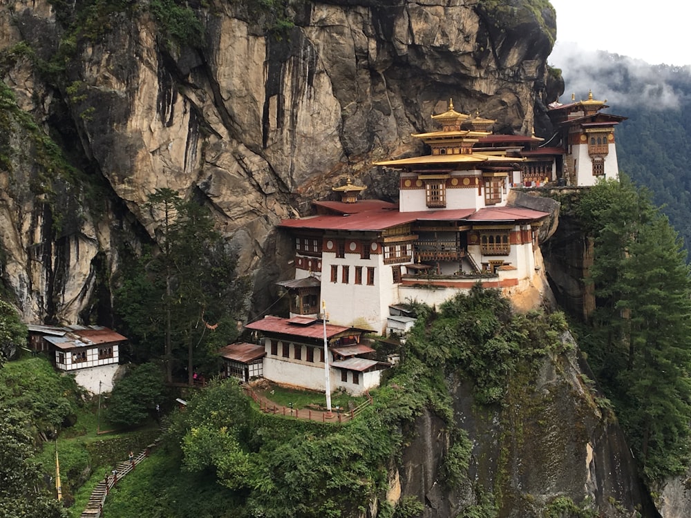 white and red building on a mountainside