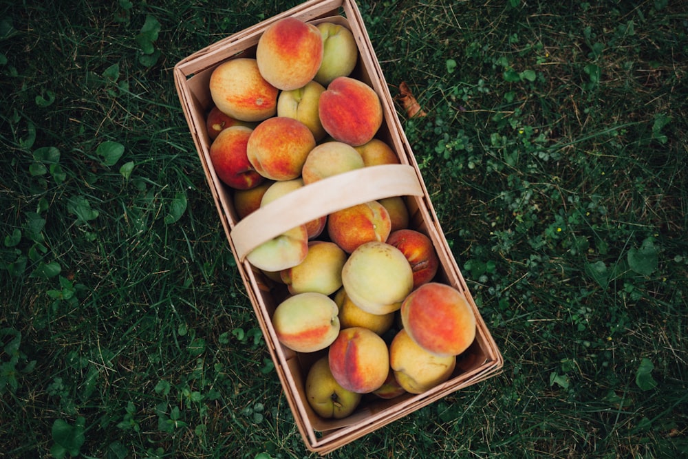 nectarines in brown basket