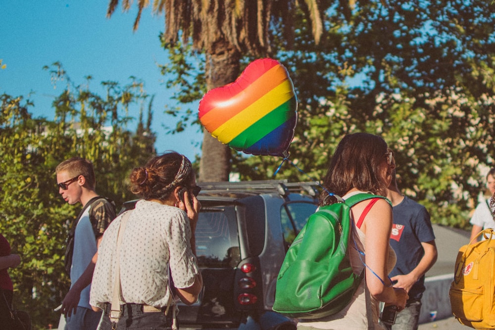 women walking near car