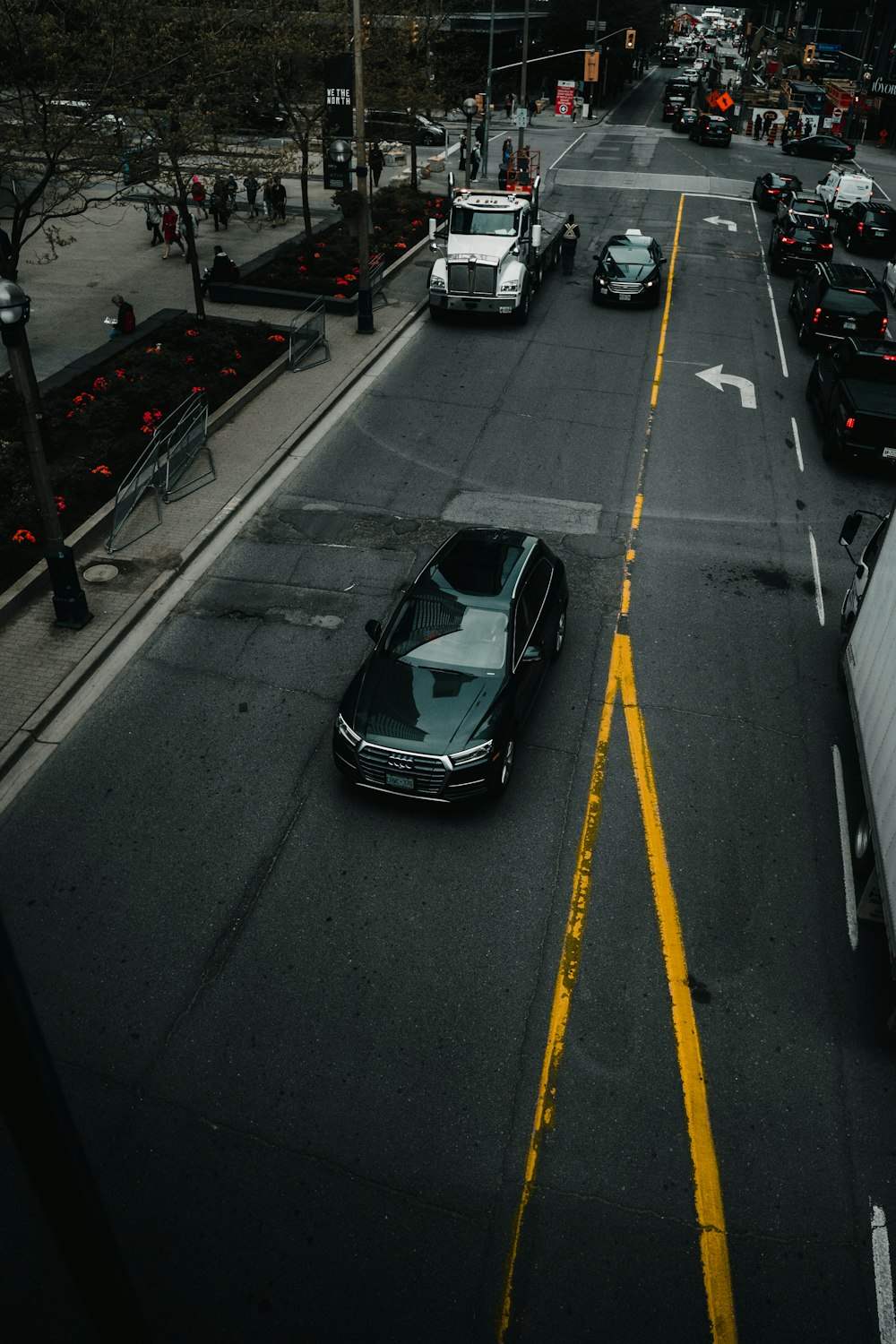 black sedan on asphalt road