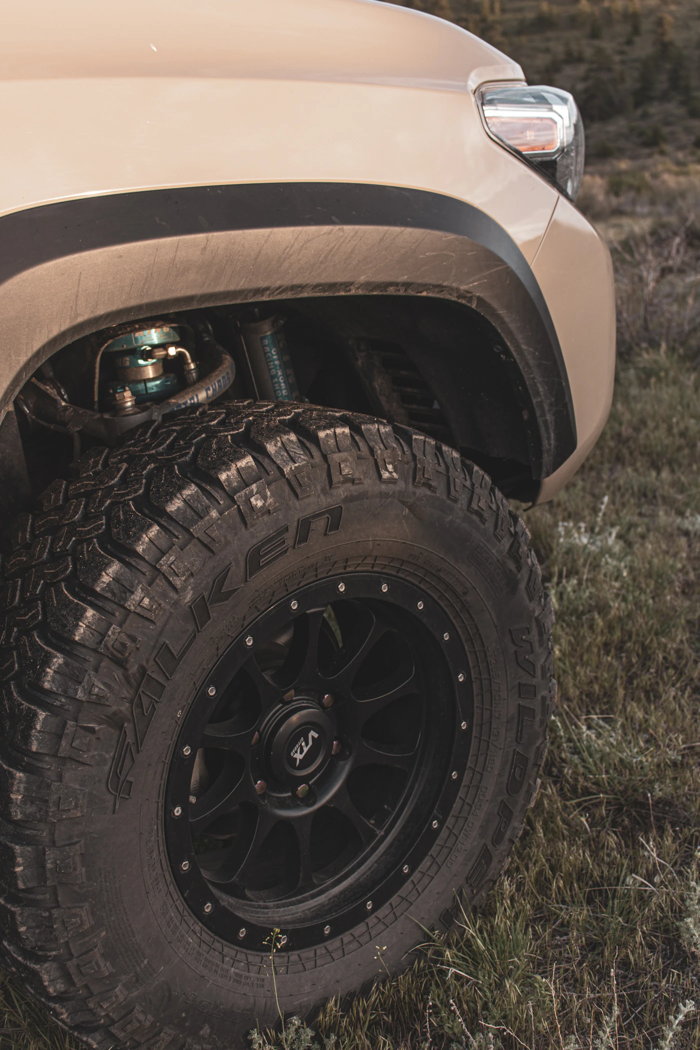 All-terrain SUV tyre with reinforced sidewall on a black rim