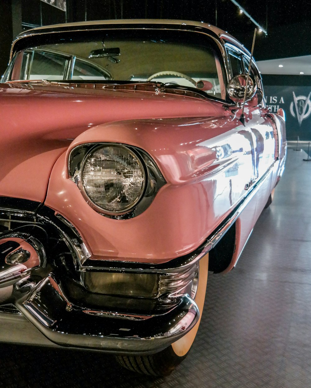 pink vehicle parked in room