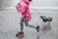 girl holding leash during daytime