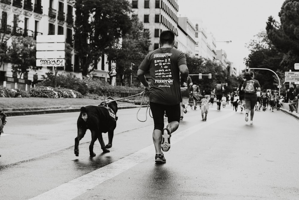 person running with dog at the road