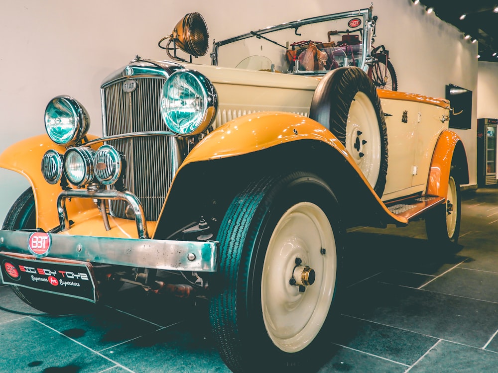 vintage white and yellow vehicle close-up photography