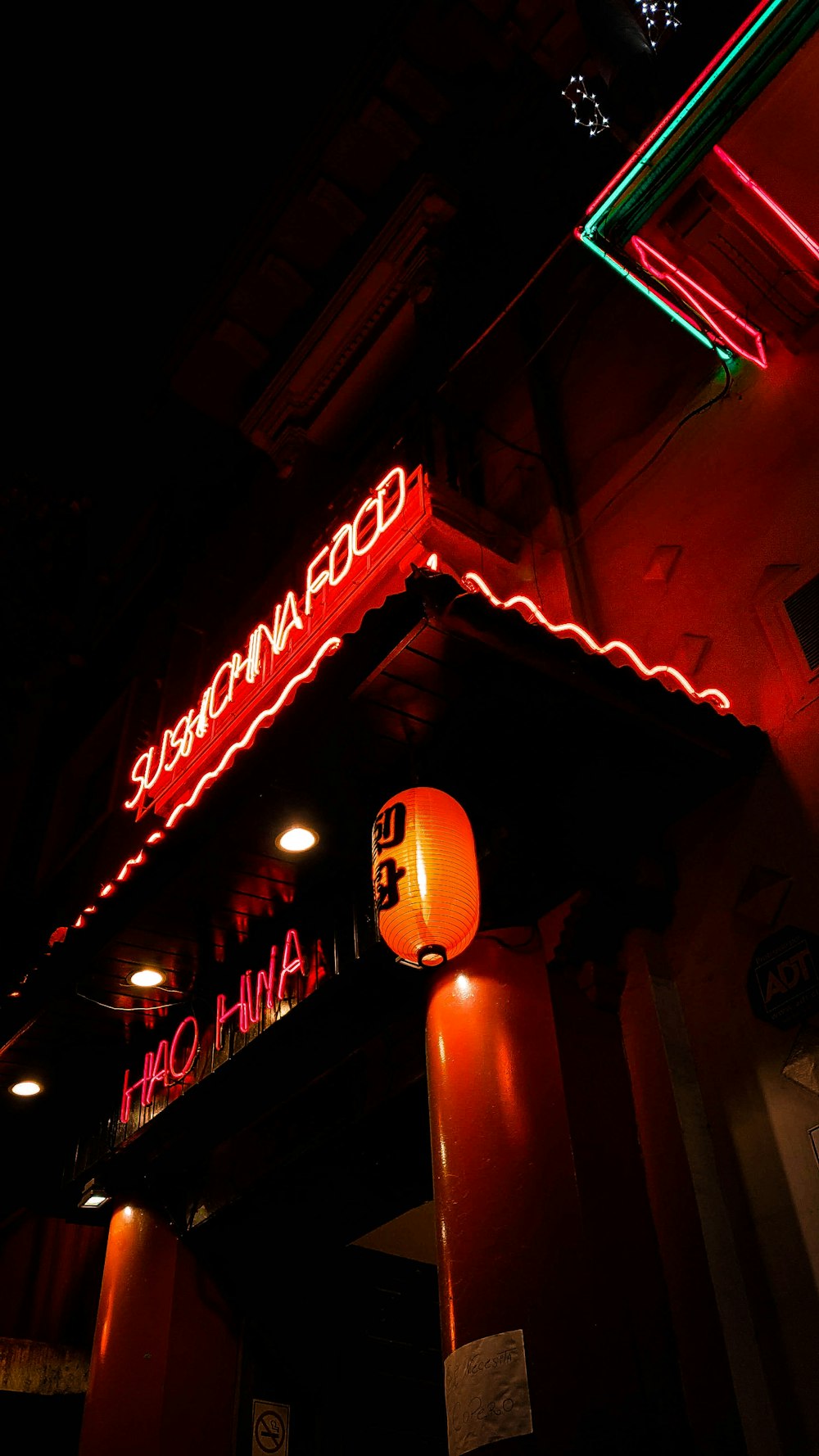 a neon sign on the side of a building