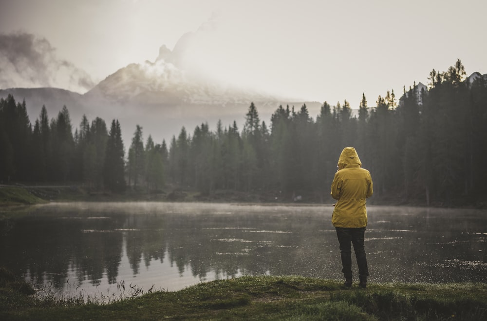 person standing near body of water