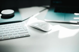 A serene workspace featuring minimalist design with deep charcoal and pearl white accents.