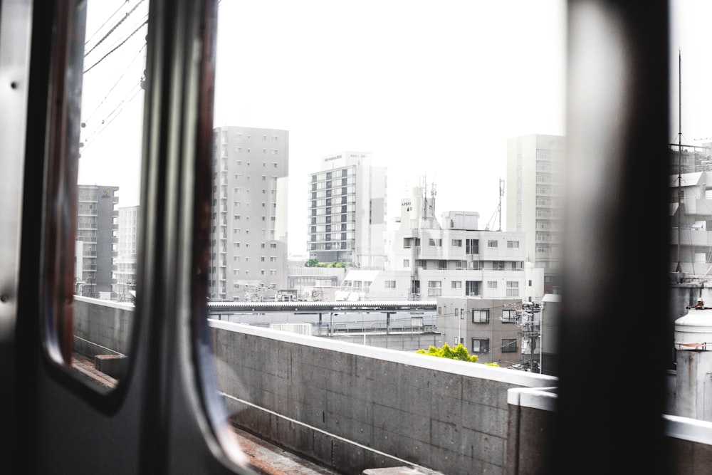 a view of a city from a train window