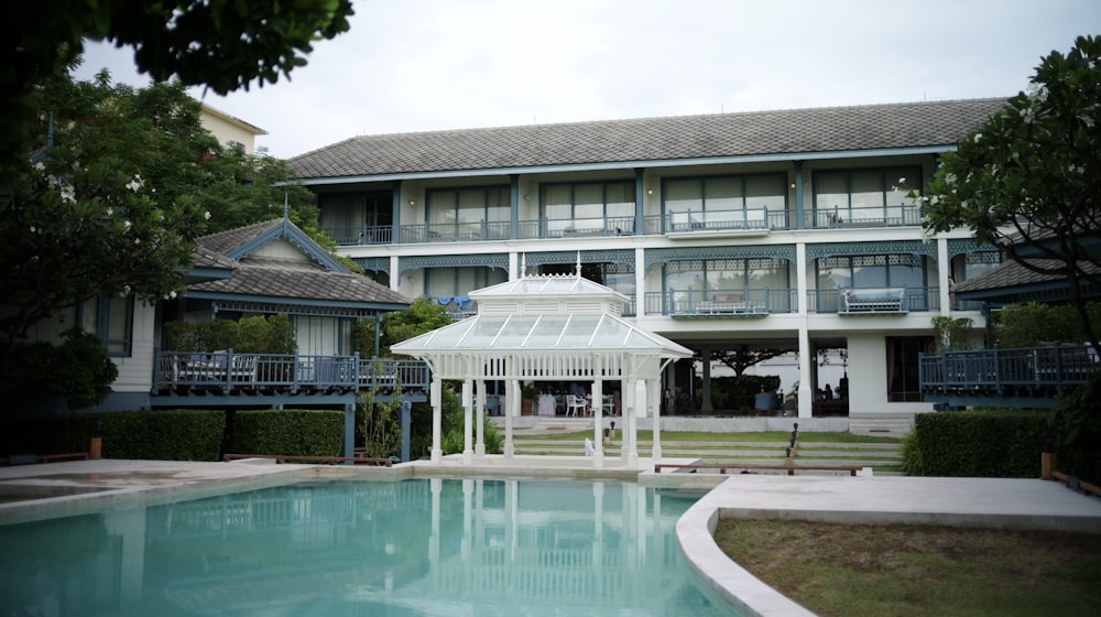 swimming pool in front of building during daytime