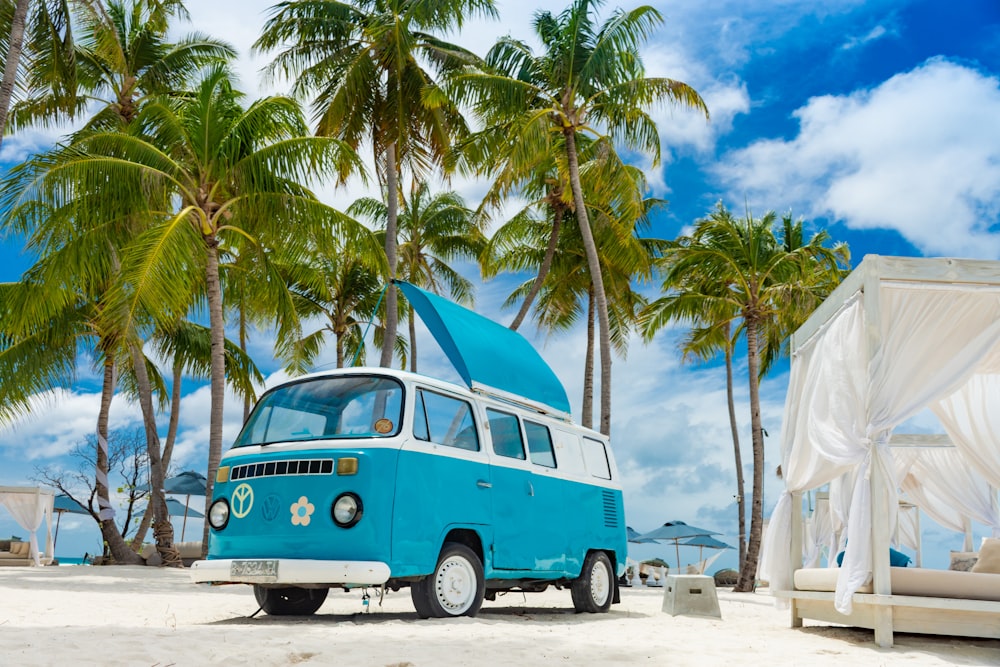 blue and white van on beach