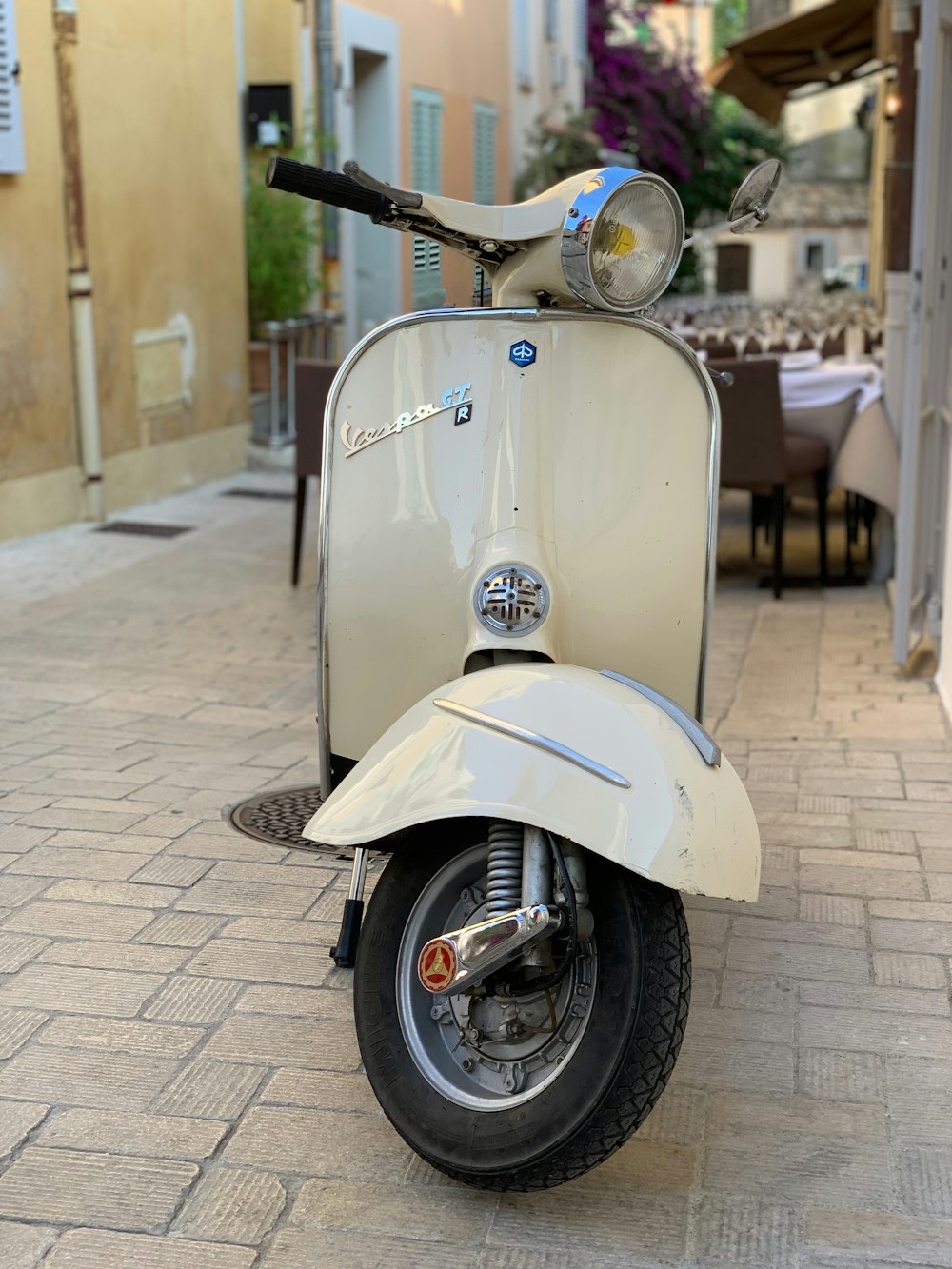 a scooter parked on the side of the road