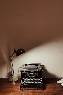 turned-on desk lamp near calculator Agencia La Movida Copywriting