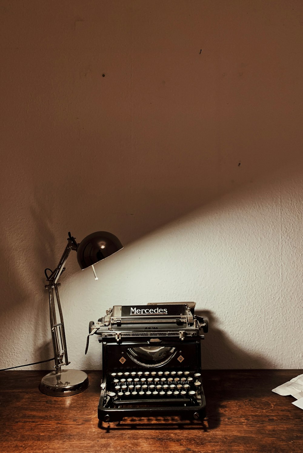 turned-on desk lamp near calculator