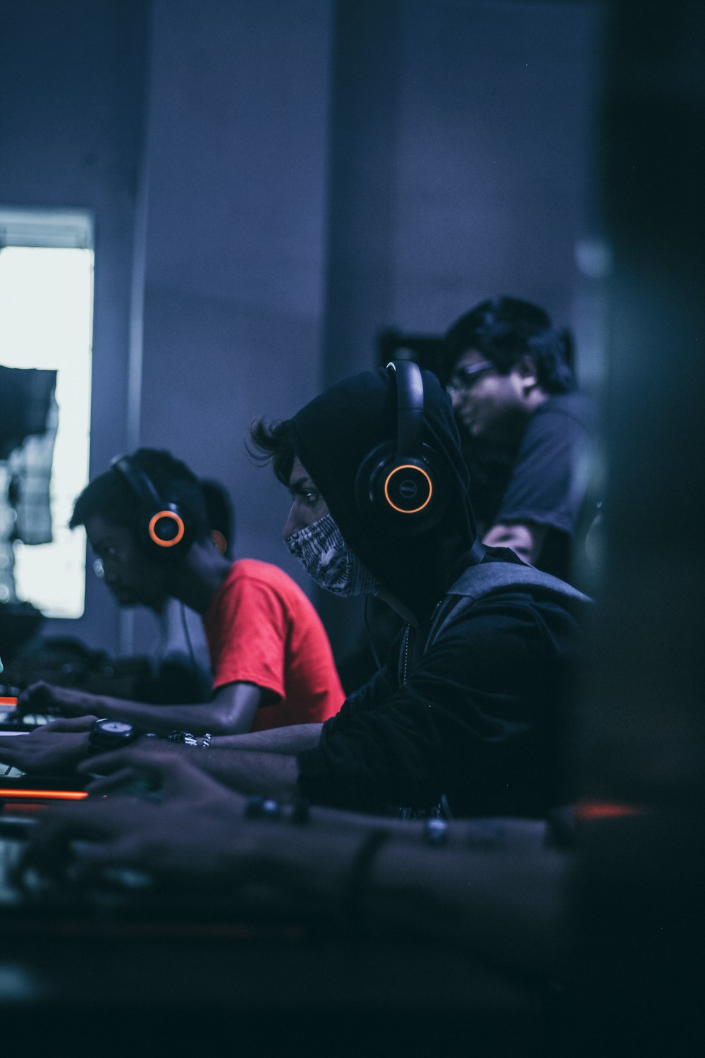 group of computer gamers in a computer shop