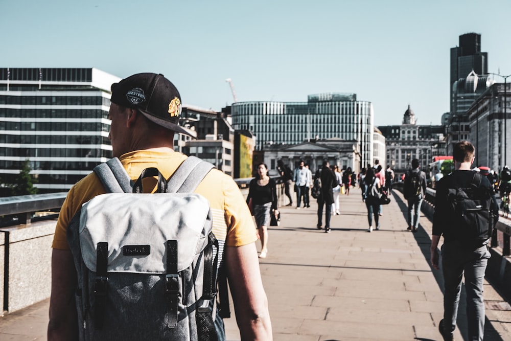 people walking towards building during daytime