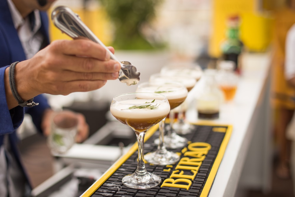 man making cocktail drink outside