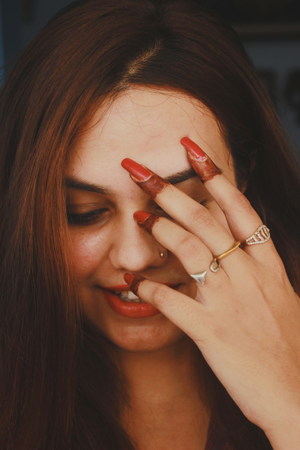 woman covering her face