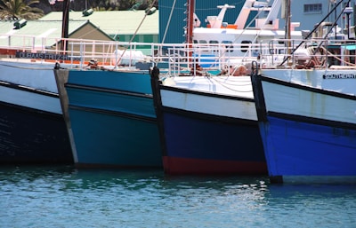 Colorful fishing boats docked in the charming port of Tarifa.
