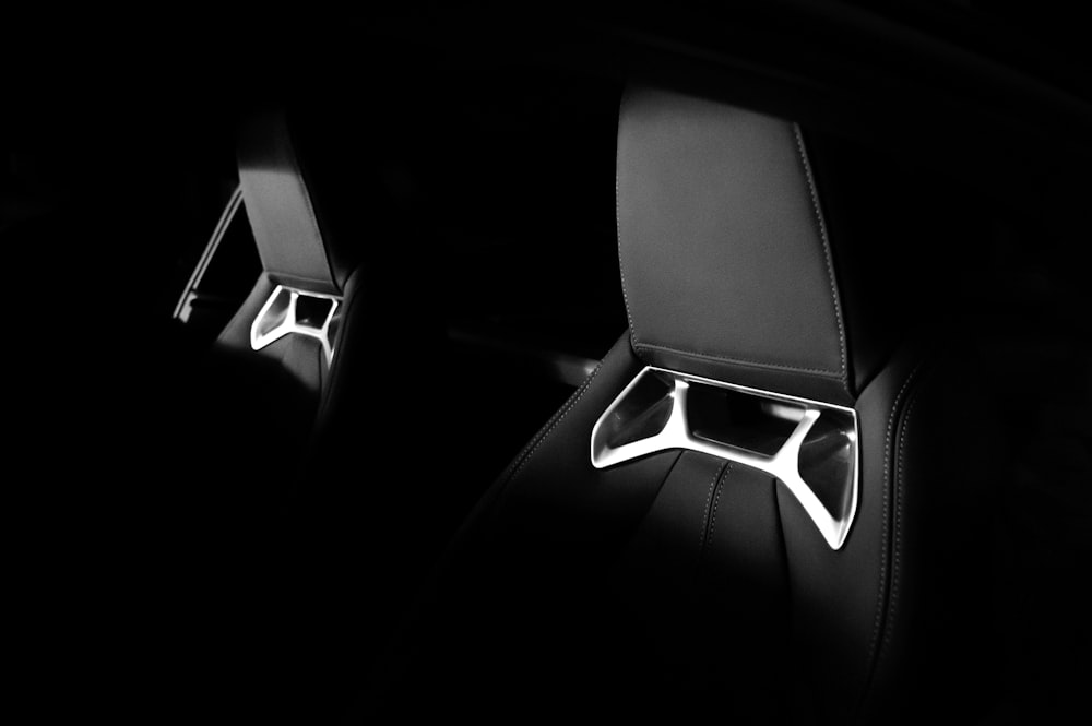 a pair of speakers sitting on top of a black floor