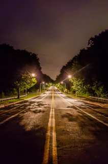 empty asphalt road photo during nighttime