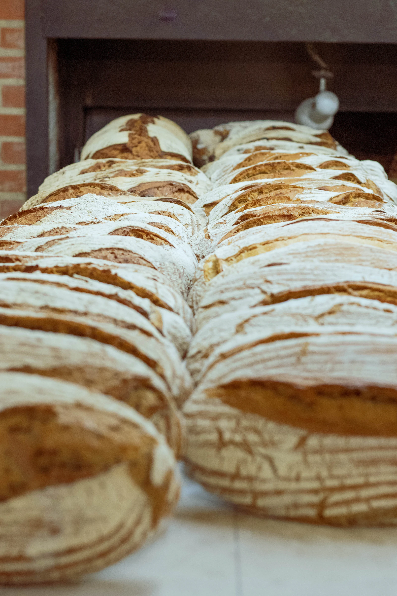 Rows of fresh bread on production racks