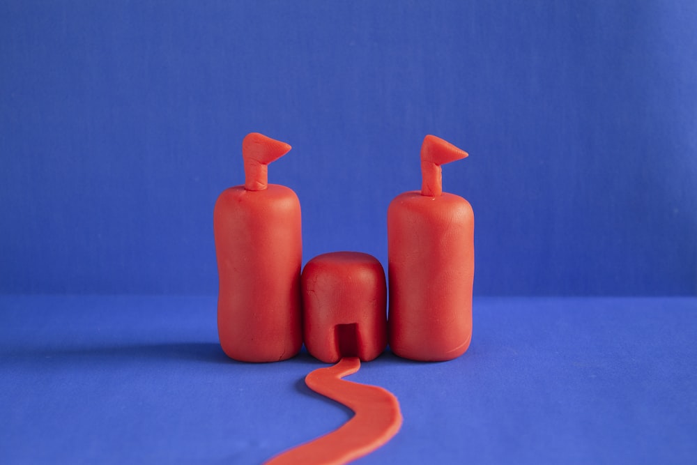 a couple of bottles sitting on top of a blue surface