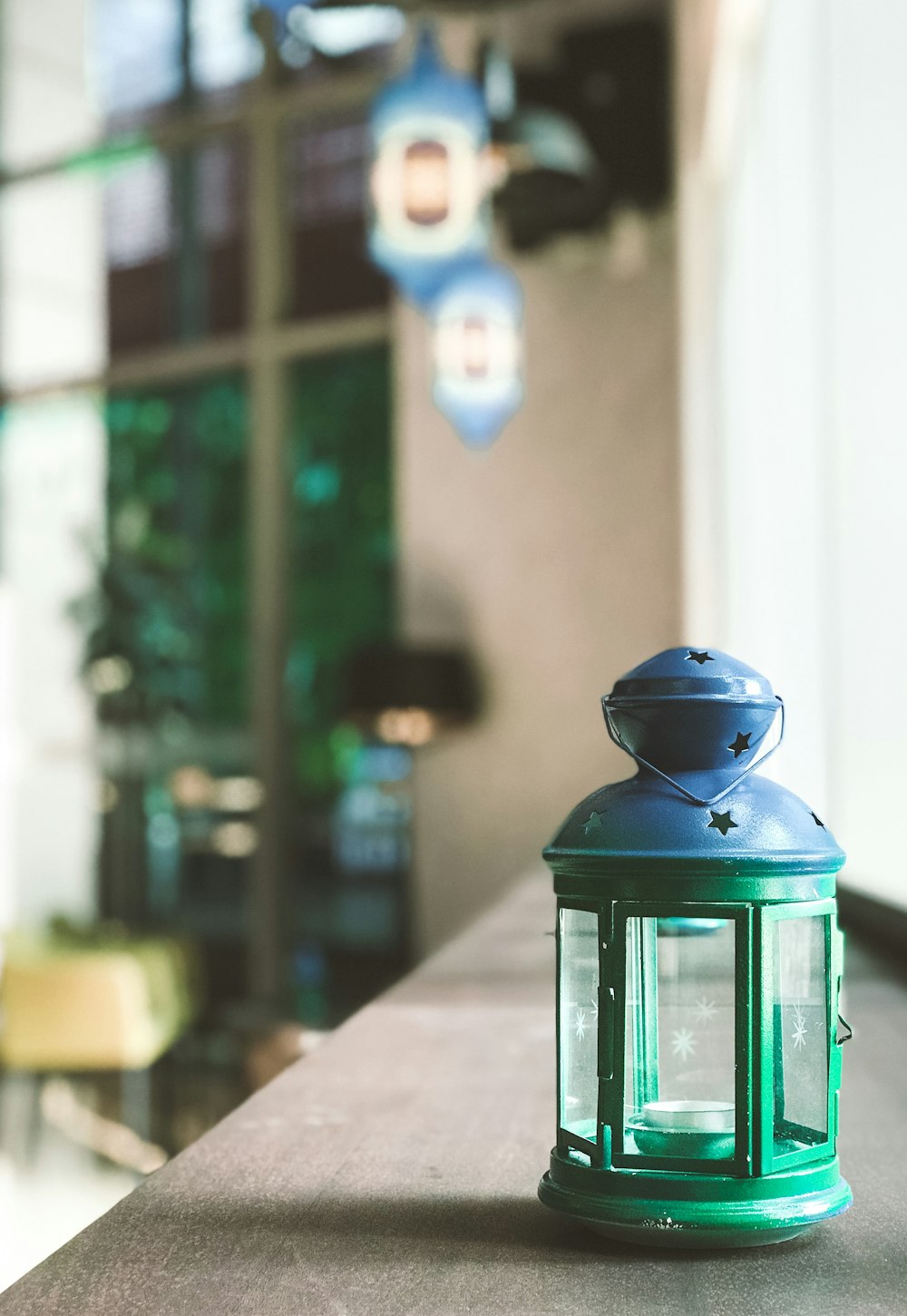 green lantern on brown table