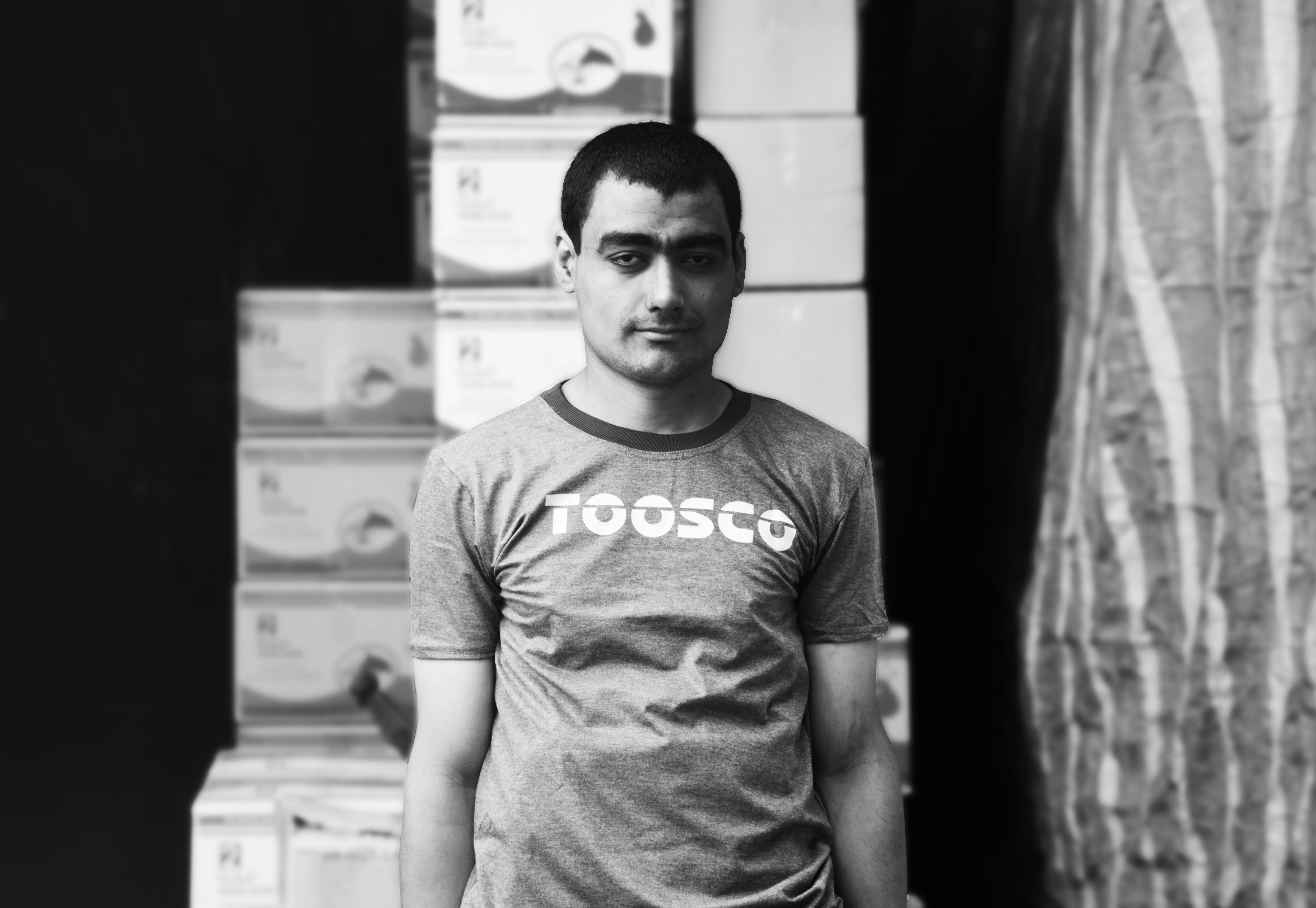 grayscale photo of man wearing t-shirt