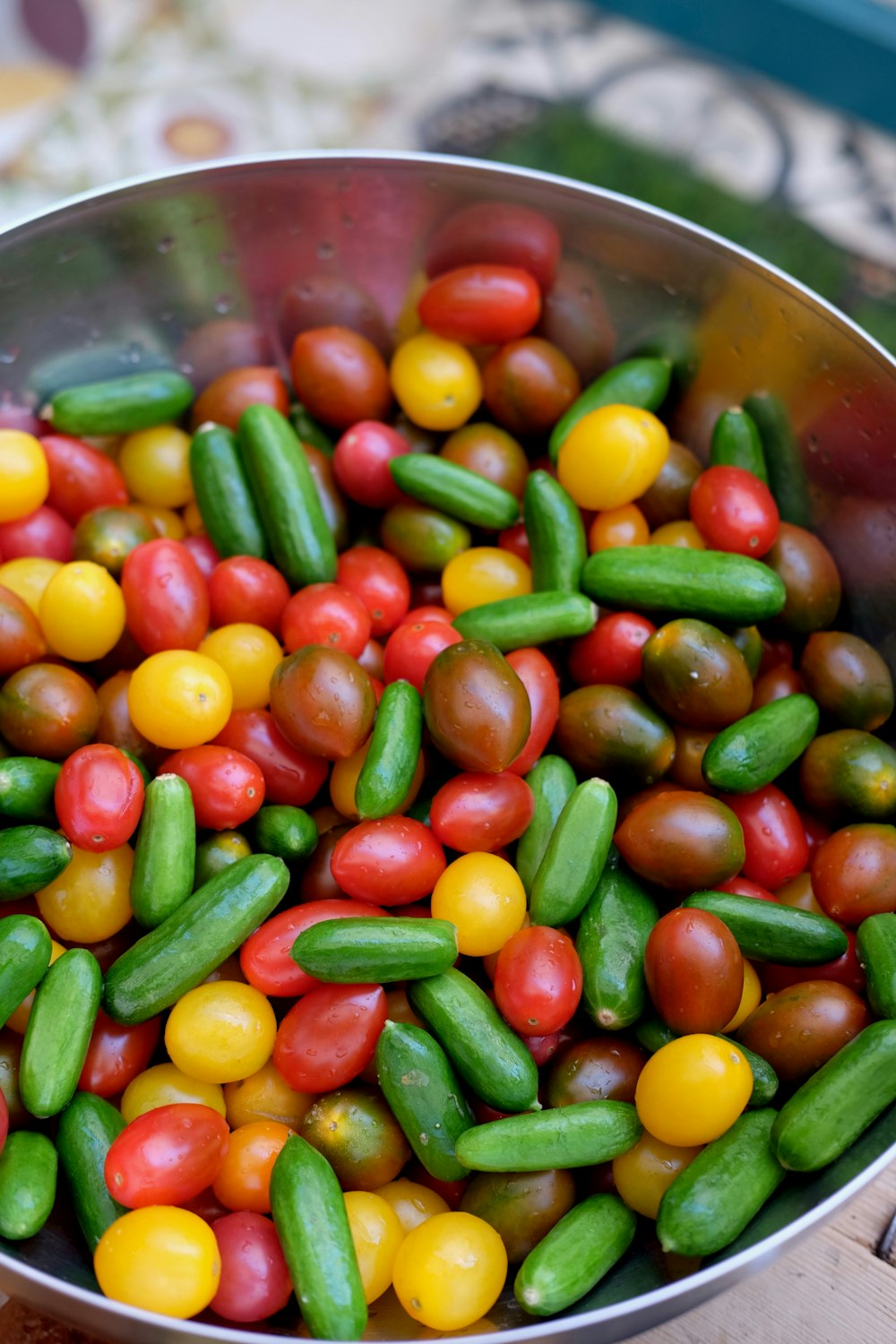 silver-colored bowl filled with multicolored beans close-up photography