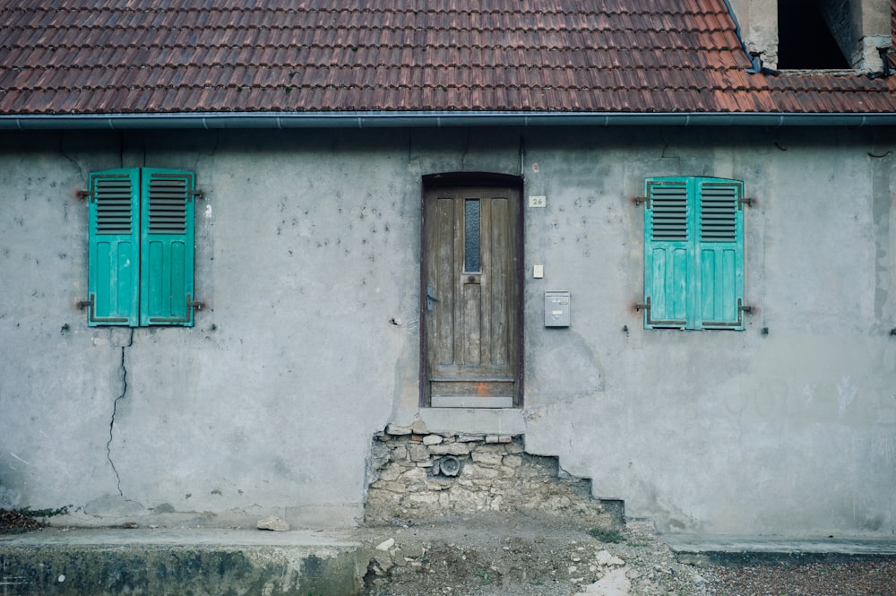 white concrete house showing closed door