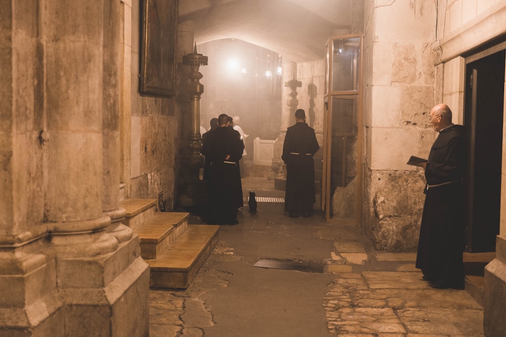 priests standing in well-lit room