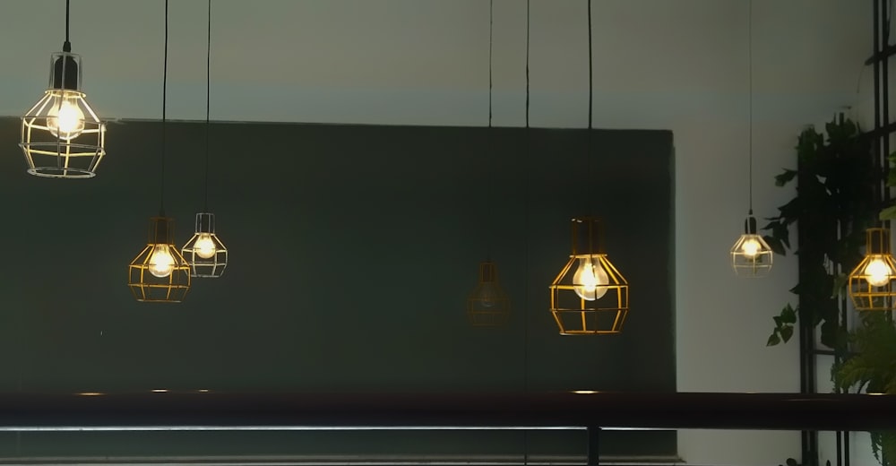 turned-on yellow pendant lamps