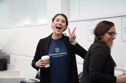 woman wearing suit making hand peace sign