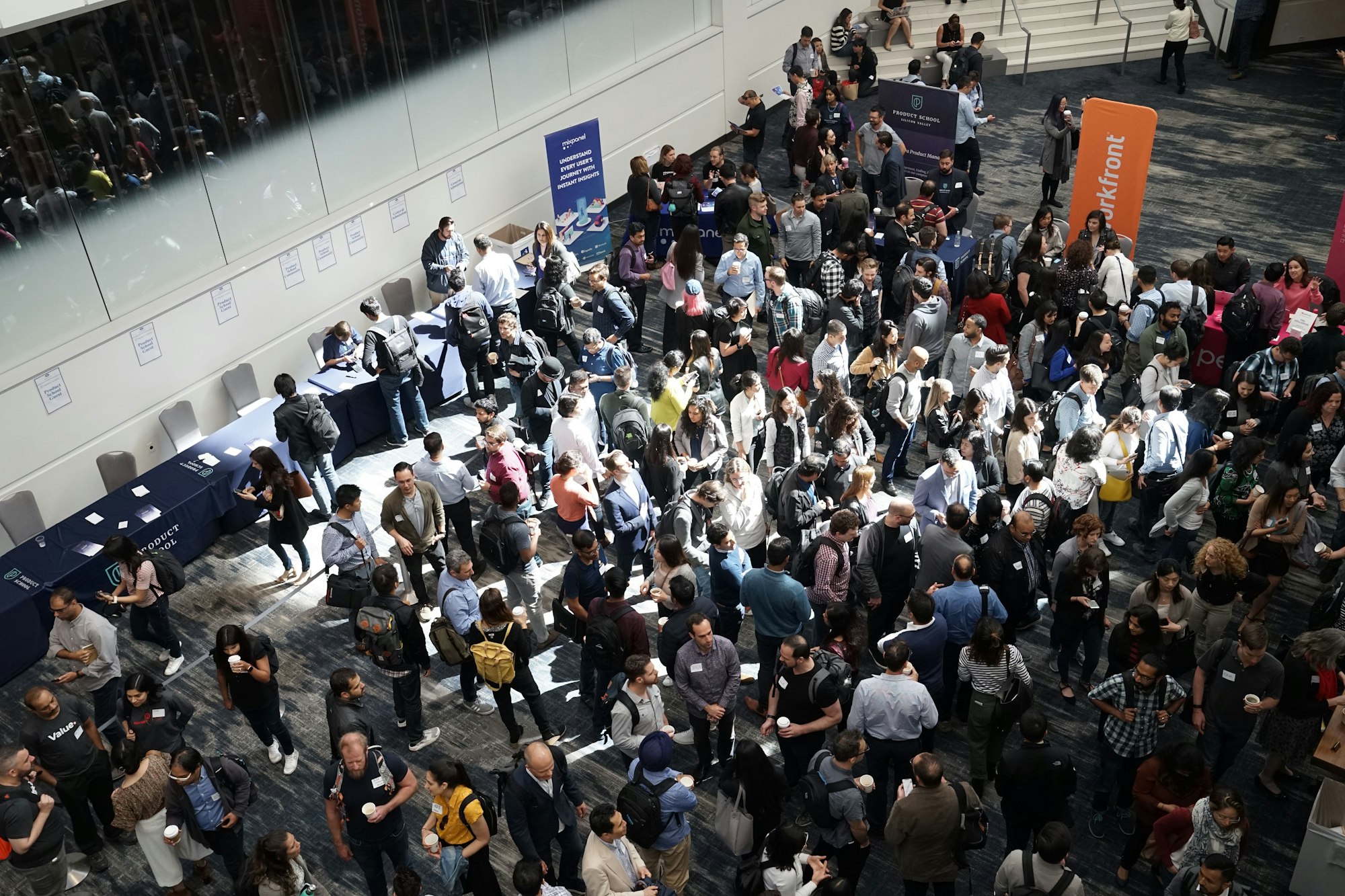 top-down picture of people evaluating software solutions at a trade show