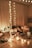 A cozy, warmly lit room set up for an intimate couples retreat with cushions and soft blankets.