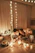 A happy couple enjoying a private romantic dinner setup with candles and flowers.