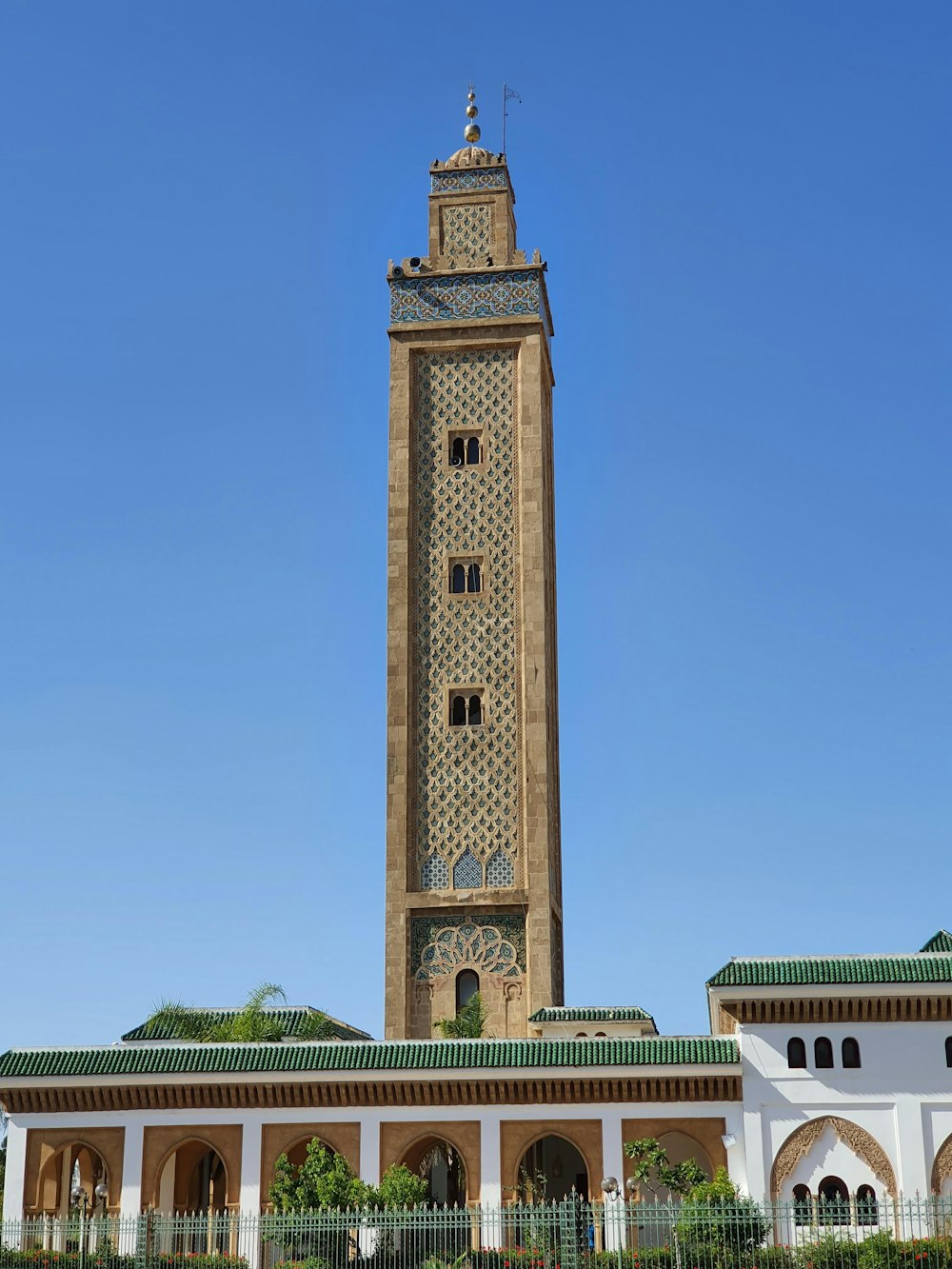 brown concrete tower under clear blue sky