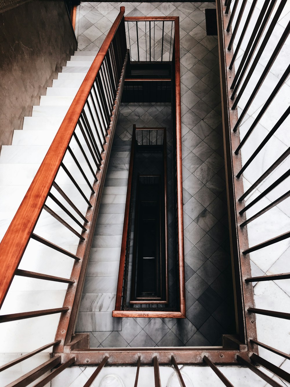 high-angle photo of black and white staircase