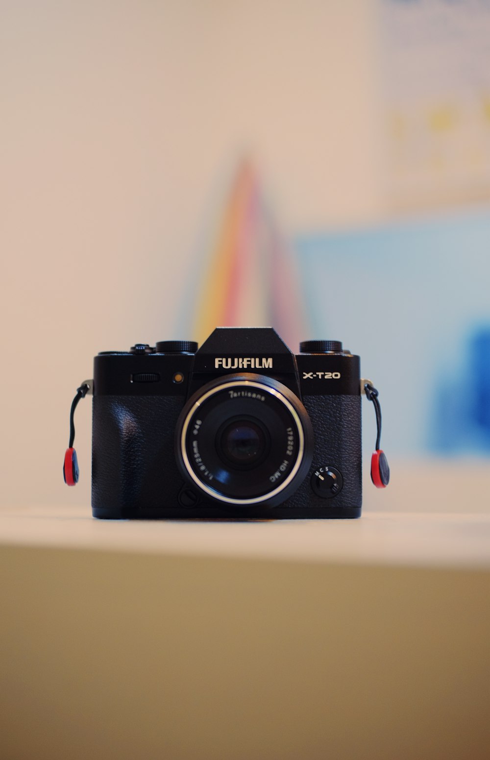 black and gray Fujifilm SLR camera