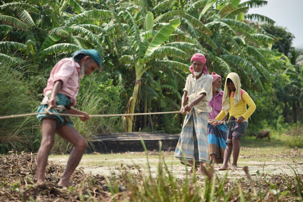 men tugging a rope