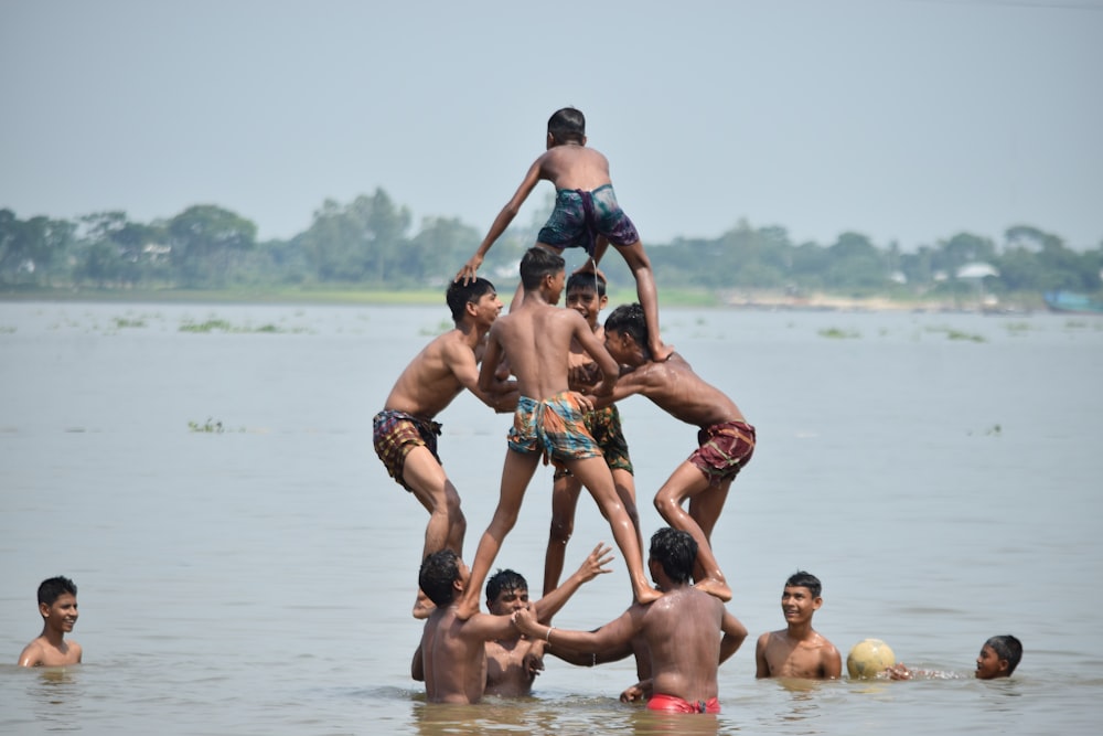 children forming a pyramid on a beach