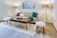 A freshly painted cozy living room with warm beige walls and soft lighting.