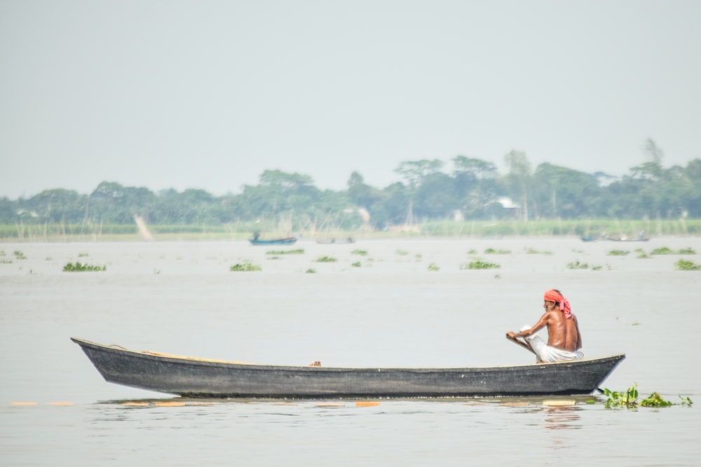 man riding on boat