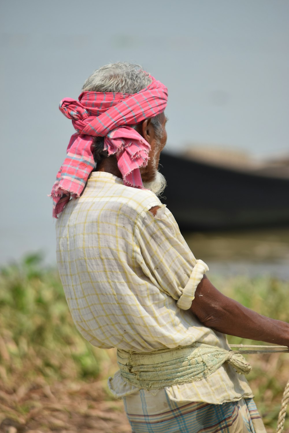 man in pink headscarf