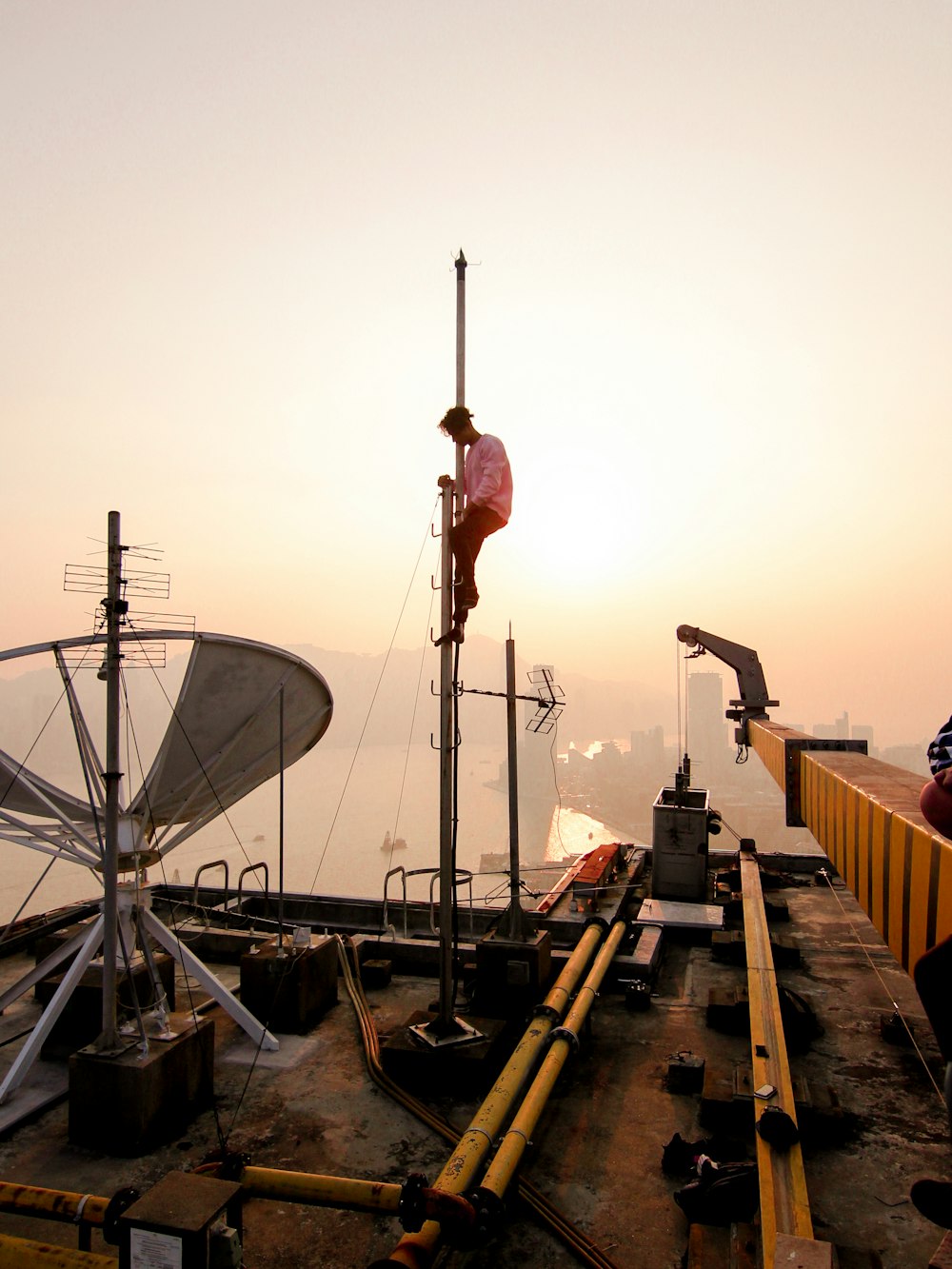 unknown person climbing on pole