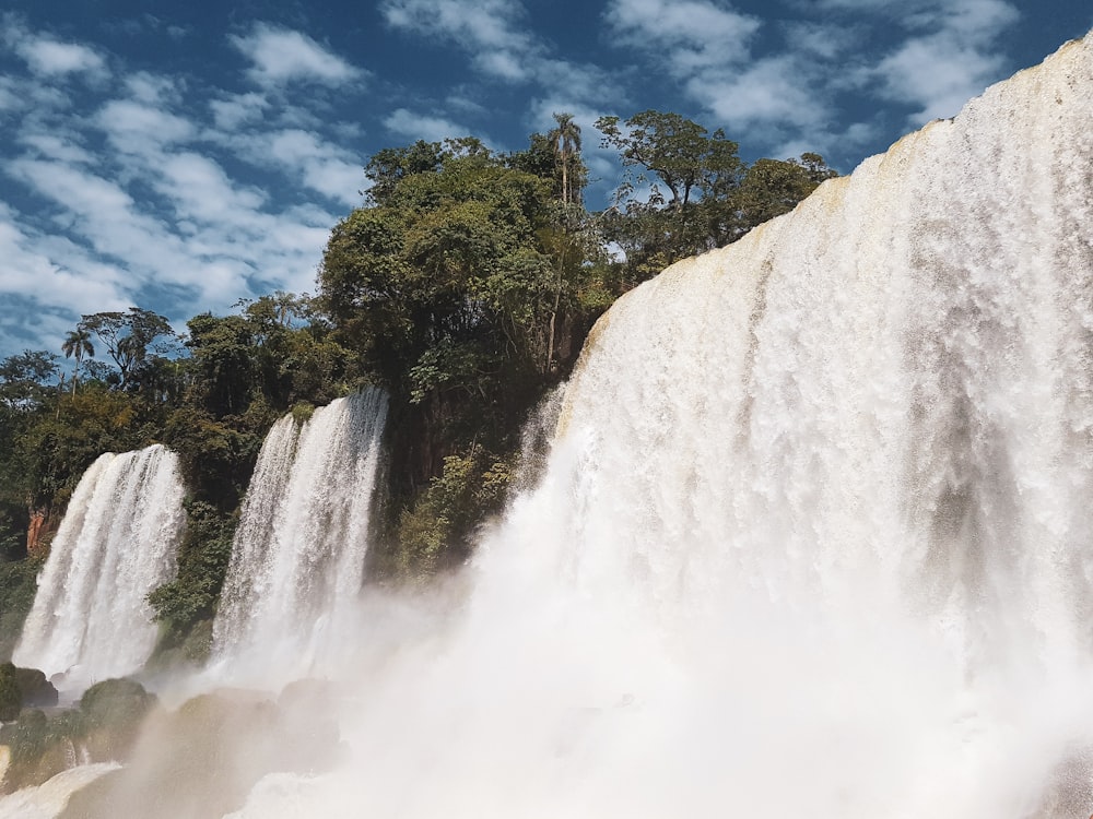 photo of waterfalls across blue sky