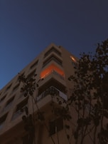 City view from a high-rise apartment balcony during twilight.
